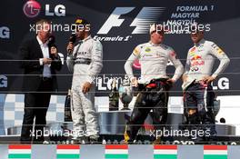 The podium (L to R): Martin Brundle (GBR) Sky Sports Commentator; Lewis Hamilton (GBR) Mercedes AMG F1; Kimi Raikkonen (FIN) Lotus F1 Team; Sebastian Vettel (GER) Red Bull Racing. 28.07.2013. Formula 1 World Championship, Rd 10, Hungarian Grand Prix, Budapest, Hungary, Race Day