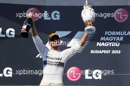 Race winner Lewis Hamilton (GBR) Mercedes AMG F1 celebrates on the podium. 28.07.2013. Formula 1 World Championship, Rd 10, Hungarian Grand Prix, Budapest, Hungary, Race Day