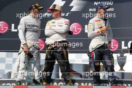 The podium (L to R): race winner Lewis Hamilton (GBR) Mercedes AMG F1; Kimi Raikkonen (FIN) Lotus F1 Team, second; and Sebastian Vettel (GER) Red Bull Racing third. 28.07.2013. Formula 1 World Championship, Rd 10, Hungarian Grand Prix, Budapest, Hungary, Race Day