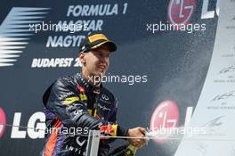 Sebastian Vettel (GER) Red Bull Racing celebrates his third position on the podium. 28.07.2013. Formula 1 World Championship, Rd 10, Hungarian Grand Prix, Budapest, Hungary, Race Day