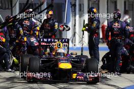 Sebastian Vettel (GER) Red Bull Racing RB9 makes a pit stop. 28.07.2013. Formula 1 World Championship, Rd 10, Hungarian Grand Prix, Budapest, Hungary, Race Day