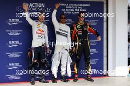 The top three qualifiers in Parc Ferme (L to R): Sebastian Vettel (GER) Red Bull Racing, second; Lewis Hamilton (GBR) Mercedes AMG F1, pole position; Romain Grosjean (FRA) Lotus F1 Team, third. 27.07.2013. Formula 1 World Championship, Rd 10, Hungarian Grand Prix, Budapest, Hungary, Qualifying Day