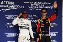 (L to R): Pole sitter Lewis Hamilton (GBR) Mercedes AMG F1 with third placed Romain Grosjean (FRA) Lotus F1 Team in parc ferme. 27.07.2013. Formula 1 World Championship, Rd 10, Hungarian Grand Prix, Budapest, Hungary, Qualifying Day