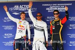 The top three qualifiers in Parc Ferme (L to R): Sebastian Vettel (GER) Red Bull Racing, second; Lewis Hamilton (GBR) Mercedes AMG F1, pole position; Romain Grosjean (FRA) Lotus F1 Team, third. 27.07.2013. Formula 1 World Championship, Rd 10, Hungarian Grand Prix, Budapest, Hungary, Qualifying Day