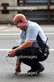 Pirelli Technician takes a track temperature reading. 27.07.2013. Formula 1 World Championship, Rd 10, Hungarian Grand Prix, Budapest, Hungary, Qualifying Day