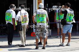 Photographers and Pit Media wearing pit lane tabards. 27.07.2013. Formula 1 World Championship, Rd 10, Hungarian Grand Prix, Budapest, Hungary, Qualifying Day
