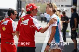 Fernando Alonso (ESP) Ferrari with Carmen Jorda (ESP) GP3 Driver. 27.07.2013. Formula 1 World Championship, Rd 10, Hungarian Grand Prix, Budapest, Hungary, Qualifying Day