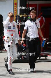 (L to R): Jenson Button (GBR) McLaren with Mike Collier (GBR) Personal Trainer during qualifying. 27.07.2013. Formula 1 World Championship, Rd 10, Hungarian Grand Prix, Budapest, Hungary, Qualifying Day