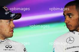 (L to R): Sebastian Vettel (GER) Red Bull Racing with Lewis Hamilton (GBR) Mercedes AMG F1 in the FIA Press Conference. 27.07.2013. Formula 1 World Championship, Rd 10, Hungarian Grand Prix, Budapest, Hungary, Qualifying Day