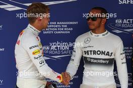 Sebastian Vettel (GER) Red Bull Racing and Romain Grosjean (FRA) Lotus F1 E21. 27.07.2013. Formula 1 World Championship, Rd 10, Hungarian Grand Prix, Budapest, Hungary, Qualifying Day