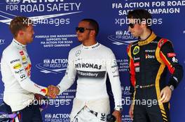 The top three qualifiers in Parc Ferme (L to R): Sebastian Vettel (GER) Red Bull Racing, second; Lewis Hamilton (GBR) Mercedes AMG F1, pole position; Romain Grosjean (FRA) Lotus F1 Team, third. 27.07.2013. Formula 1 World Championship, Rd 10, Hungarian Grand Prix, Budapest, Hungary, Qualifying Day