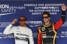 Lewis Hamilton (GBR) Mercedes AMG F1 and Romain Grosjean (FRA) Lotus F1 E21. 27.07.2013. Formula 1 World Championship, Rd 10, Hungarian Grand Prix, Budapest, Hungary, Qualifying Day