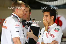 (L to R): Martin Whitmarsh (GBR) McLaren Chief Executive Officer talks with Sergio Perez (MEX) McLaren after he crashed in the third practice session. 27.07.2013. Formula 1 World Championship, Rd 10, Hungarian Grand Prix, Budapest, Hungary, Qualifying Day