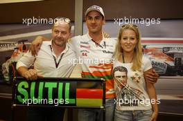 Adrian Sutil (GER) Sahara Force India F1 celebrates his 100th GP with girlfriend Jennifer Becks (GER) and his Manager Manfred Zimmerman (GER) CMG. 28.07.2013. Formula 1 World Championship, Rd 10, Hungarian Grand Prix, Budapest, Hungary, Race Day