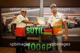 Dr. Vijay Mallya (IND) Sahara Force India F1 Team Owner presents a ceramic wheel rim, signed by the team, to Adrian Sutil (GER) Sahara Force India F1, who is celebrating his 100th GP. 28.07.2013. Formula 1 World Championship, Rd 10, Hungarian Grand Prix, Budapest, Hungary, Race Day