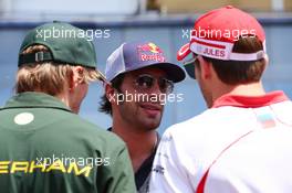 (L to R): Charles Pic (FRA) Caterham with Daniel Ricciardo (AUS) Scuderia Toro Rosso and Jules Bianchi (FRA) Marussia F1 Team on the drivers parade. 28.07.2013. Formula 1 World Championship, Rd 10, Hungarian Grand Prix, Budapest, Hungary, Race Day