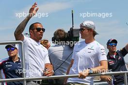 (L to R): Lewis Hamilton (GBR) Mercedes AMG F1 with team mate Nico Rosberg (GER) Mercedes AMG F1 on the drivers parade. 28.07.2013. Formula 1 World Championship, Rd 10, Hungarian Grand Prix, Budapest, Hungary, Race Day