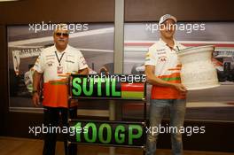 Dr. Vijay Mallya (IND) Sahara Force India F1 Team Owner presents a ceramic wheel rim, signed by the team, to Adrian Sutil (GER) Sahara Force India F1, who is celebrating his 100th GP. 28.07.2013. Formula 1 World Championship, Rd 10, Hungarian Grand Prix, Budapest, Hungary, Race Day