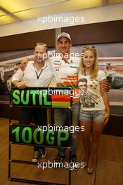 Adrian Sutil (GER) Sahara Force India F1 celebrates his 100th GP with girlfriend Jennifer Becks (GER) and his Manager Manfred Zimmerman (GER) CMG. 28.07.2013. Formula 1 World Championship, Rd 10, Hungarian Grand Prix, Budapest, Hungary, Race Day