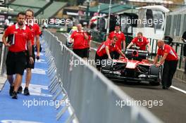 A Marussia F1 Team MR02 is pushed down the pit lane. 25.07.2013. Formula 1 World Championship, Rd 10, Hungarian Grand Prix, Budapest, Hungary, Preparation Day