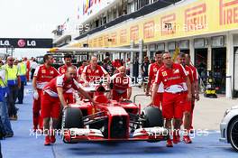 Ferrari F138 pushed to scrutineering. 25.07.2013. Formula 1 World Championship, Rd 10, Hungarian Grand Prix, Budapest, Hungary, Preparation Day