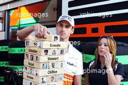 Adrian Sutil (GER) Sahara Force India F1 plays the Sky Sports F1 Horse Power Tower with Natalie Pinkham (GBR) Sky Sports Presenter. 25.07.2013. Formula 1 World Championship, Rd 10, Hungarian Grand Prix, Budapest, Hungary, Preparation Day
