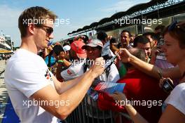 Nico Hulkenberg (GER) Sauber signs autographs for the fans. 25.07.2013. Formula 1 World Championship, Rd 10, Hungarian Grand Prix, Budapest, Hungary, Preparation Day