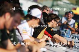 Romain Grosjean (FRA) Lotus F1 Team signs autographs for the fans. 25.07.2013. Formula 1 World Championship, Rd 10, Hungarian Grand Prix, Budapest, Hungary, Preparation Day