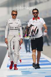 (L to R): Max Chilton (GBR) Marussia F1 Team with Sam Village (GBR) Marussia F1 Team. 25.10.2013. Formula 1 World Championship, Rd 16, Indian Grand Prix, New Delhi, India, Practice Day.