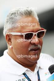 Dr. Vijay Mallya (IND) Sahara Force India F1 Team Owner with the media. 25.10.2013. Formula 1 World Championship, Rd 16, Indian Grand Prix, New Delhi, India, Practice Day.