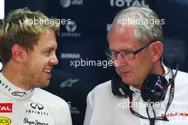 (L to R): Sebastian Vettel (GER) Red Bull Racing with Dr Helmut Marko (AUT) Red Bull Motorsport Consultant. 25.10.2013. Formula 1 World Championship, Rd 16, Indian Grand Prix, New Delhi, India, Practice Day.
