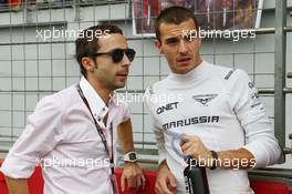 Jules Bianchi (FRA) Marussia F1 Team with Nicolas Todt (FRA) Driver Manager on the grid.  27.10.2013. Formula 1 World Championship, Rd 16, Indian Grand Prix, New Delhi, India, Race Day.