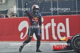Race winner and World Champion Sebastian Vettel (GER) Red Bull Racing RB9 celebrates at the end of the race. 27.10.2013. Formula 1 World Championship, Rd 16, Indian Grand Prix, New Delhi, India, Race Day.
