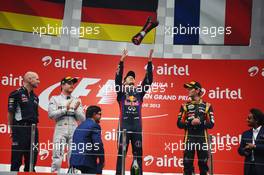 The podium (L to R): Nico Rosberg (GER) Mercedes AMG F1, second; Sebastian Vettel (GER) Red Bull Racing, race winner and World Champion; Romain Grosjean (FRA) Lotus F1 Team, third. 27.10.2013. Formula 1 World Championship, Rd 16, Indian Grand Prix, New Delhi, India, Race Day.