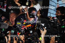 Race winner and World Champion Sebastian Vettel (GER) Red Bull Racing celebrates with  the team. 27.10.2013. Formula 1 World Championship, Rd 16, Indian Grand Prix, New Delhi, India, Race Day.