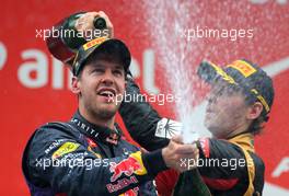 Sebastian Vettel (GER), Red Bull Racing and Romain Grosjean (FRA), Lotus F1 Team  27.10.2013. Formula 1 World Championship, Rd 16, Indian Grand Prix, New Delhi, India, Race Day.