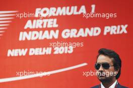 Sameer Gaur (IND) Jaypee Group Managing Director on the podium. 27.10.2013. Formula 1 World Championship, Rd 16, Indian Grand Prix, New Delhi, India, Race Day.