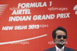 Sameer Gaur (IND) Jaypee Group Managing Director on the podium. 27.10.2013. Formula 1 World Championship, Rd 16, Indian Grand Prix, New Delhi, India, Race Day.