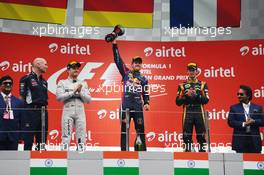 The podium (L to R): Nico Rosberg (GER) Mercedes AMG F1, second; Sebastian Vettel (GER) Red Bull Racing, race winner and World Champion; Romain Grosjean (FRA) Lotus F1 Team, third. 27.10.2013. Formula 1 World Championship, Rd 16, Indian Grand Prix, New Delhi, India, Race Day.