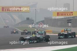 Nico Rosberg (GER) Mercedes AMG F1 W04 leads team mate Lewis Hamilton (GBR) Mercedes AMG F1 W04. 27.10.2013. Formula 1 World Championship, Rd 16, Indian Grand Prix, New Delhi, India, Race Day.