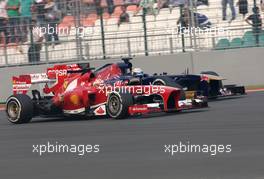 Fernando Alonso (ESP), Scuderia Ferrari and Jean-Eric Vergne (FRA), Scuderia Toro Rosso   27.10.2013. Formula 1 World Championship, Rd 16, Indian Grand Prix, New Delhi, India, Race Day.