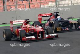 Fernando Alonso (ESP), Scuderia Ferrari and Jean-Eric Vergne (FRA), Scuderia Toro Rosso   27.10.2013. Formula 1 World Championship, Rd 16, Indian Grand Prix, New Delhi, India, Race Day.