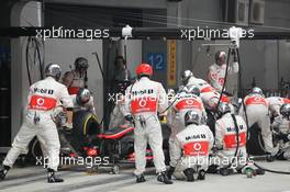 Sergio Perez (MEX) McLaren MP4-28 makes a pit stop. 27.10.2013. Formula 1 World Championship, Rd 16, Indian Grand Prix, New Delhi, India, Race Day.