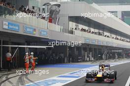 Sebastian Vettel (GER) Red Bull Racing RB9 leaves the pits. 27.10.2013. Formula 1 World Championship, Rd 16, Indian Grand Prix, New Delhi, India, Race Day.