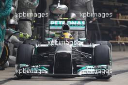 Lewis Hamilton (GBR) Mercedes AMG F1 W04 makes a pit stop. 27.10.2013. Formula 1 World Championship, Rd 16, Indian Grand Prix, New Delhi, India, Race Day.