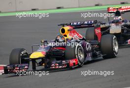 Sebastian Vettel (GER), Red Bull Racing and Daniel Ricciardo (AUS), Scuderia Toro Rosso  27.10.2013. Formula 1 World Championship, Rd 16, Indian Grand Prix, New Delhi, India, Race Day.