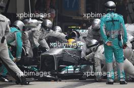 Lewis Hamilton (GBR) Mercedes AMG F1 W04 makes a pit stop. 27.10.2013. Formula 1 World Championship, Rd 16, Indian Grand Prix, New Delhi, India, Race Day.