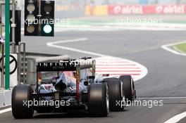 Nico Hulkenberg (GER) Sauber C32 and Sebastian Vettel (GER) Red Bull Racing RB9. 26.10.2013. Formula 1 World Championship, Rd 16, Indian Grand Prix, New Delhi, India, Qualifying Day.