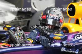 Pole sitter Sebastian Vettel (GER) Red Bull Racing RB9 in parc ferme. 26.10.2013. Formula 1 World Championship, Rd 16, Indian Grand Prix, New Delhi, India, Qualifying Day.