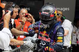 Pole sitter Sebastian Vettel (GER) Red Bull Racing uses a fan to cool the brakes on his Red Bull Racing RB9. 26.10.2013. Formula 1 World Championship, Rd 16, Indian Grand Prix, New Delhi, India, Qualifying Day.
